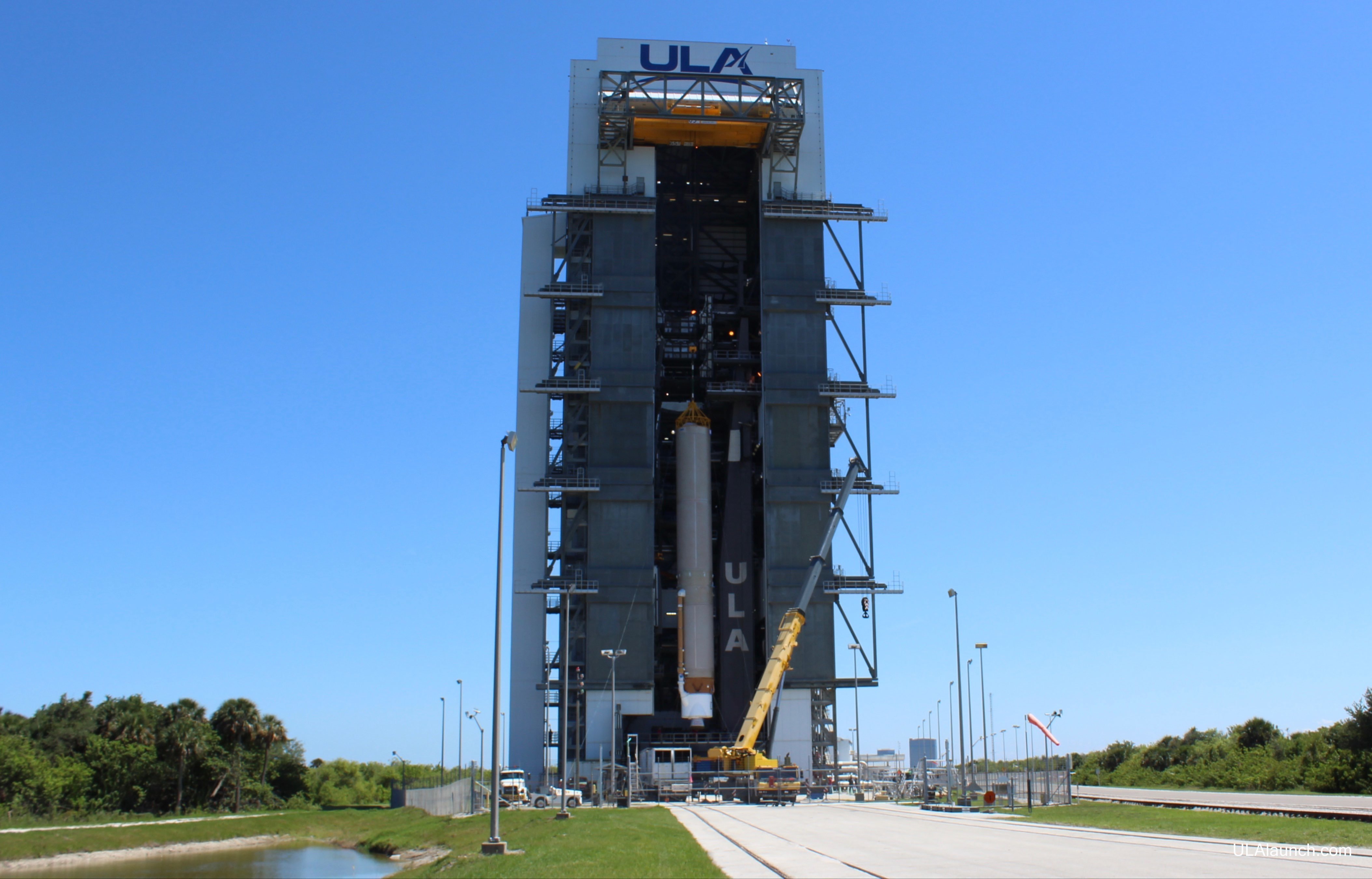 The first stage to launch AEHF-5 is hoisted onto the MLP. Photo: United Launch Alliance