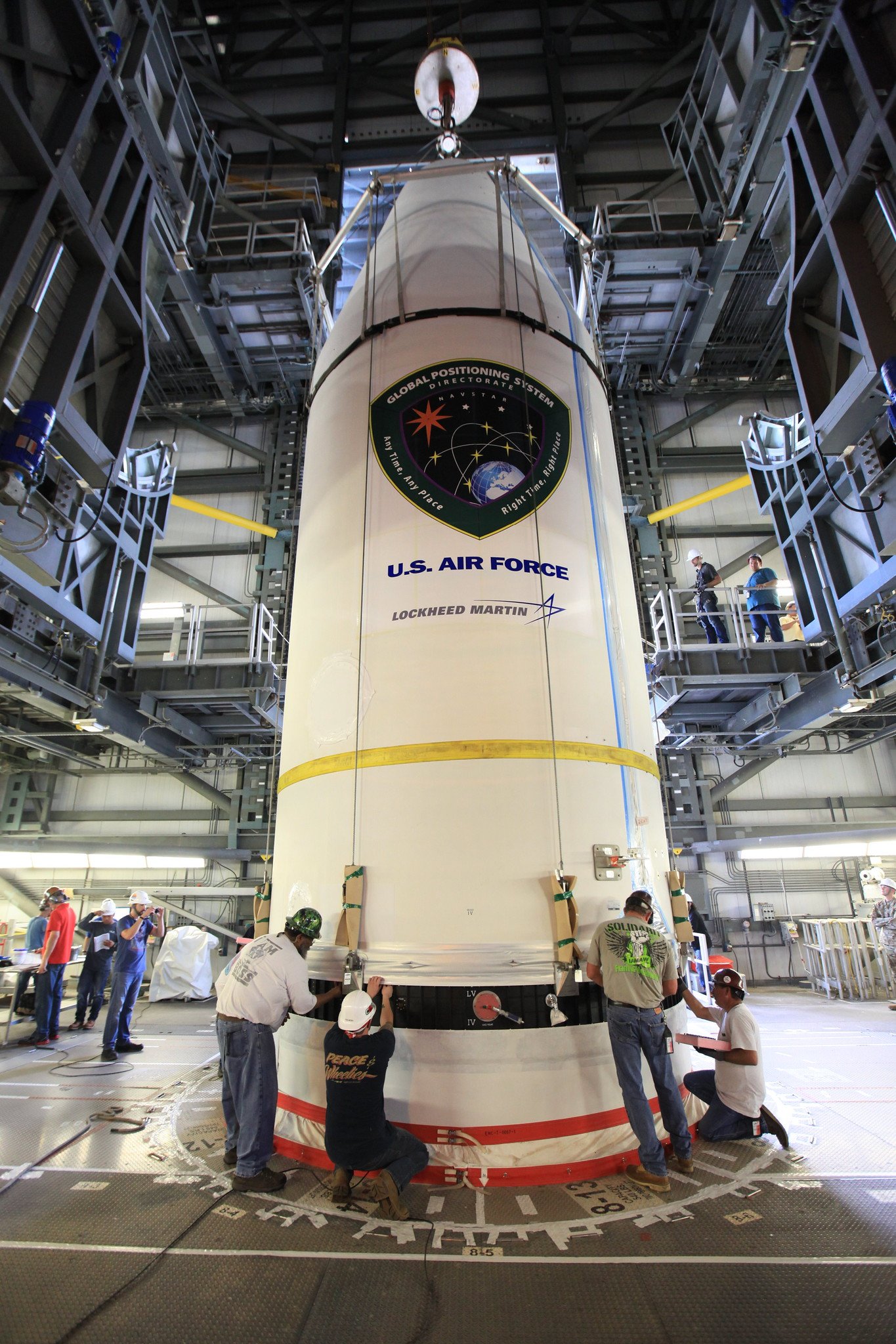 The GPS III satellite is lowered onto the Delta IV rocket. Photo by United Launch Alliance