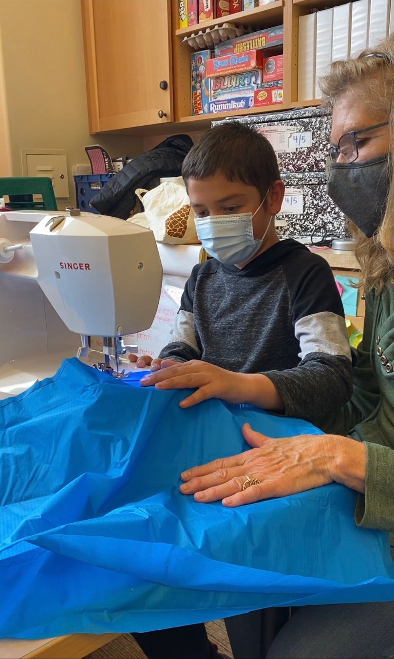 Silverton School’s Team Beaver Believer members stitch their payload parachute. Courtesy photo by Whitney Gaskill.