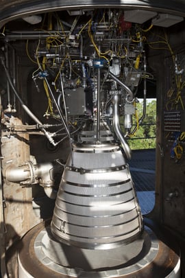 An RL10 engine stands in a vacuum chamber at a test stand in West Palm Beach, Florida. Photo by NASA