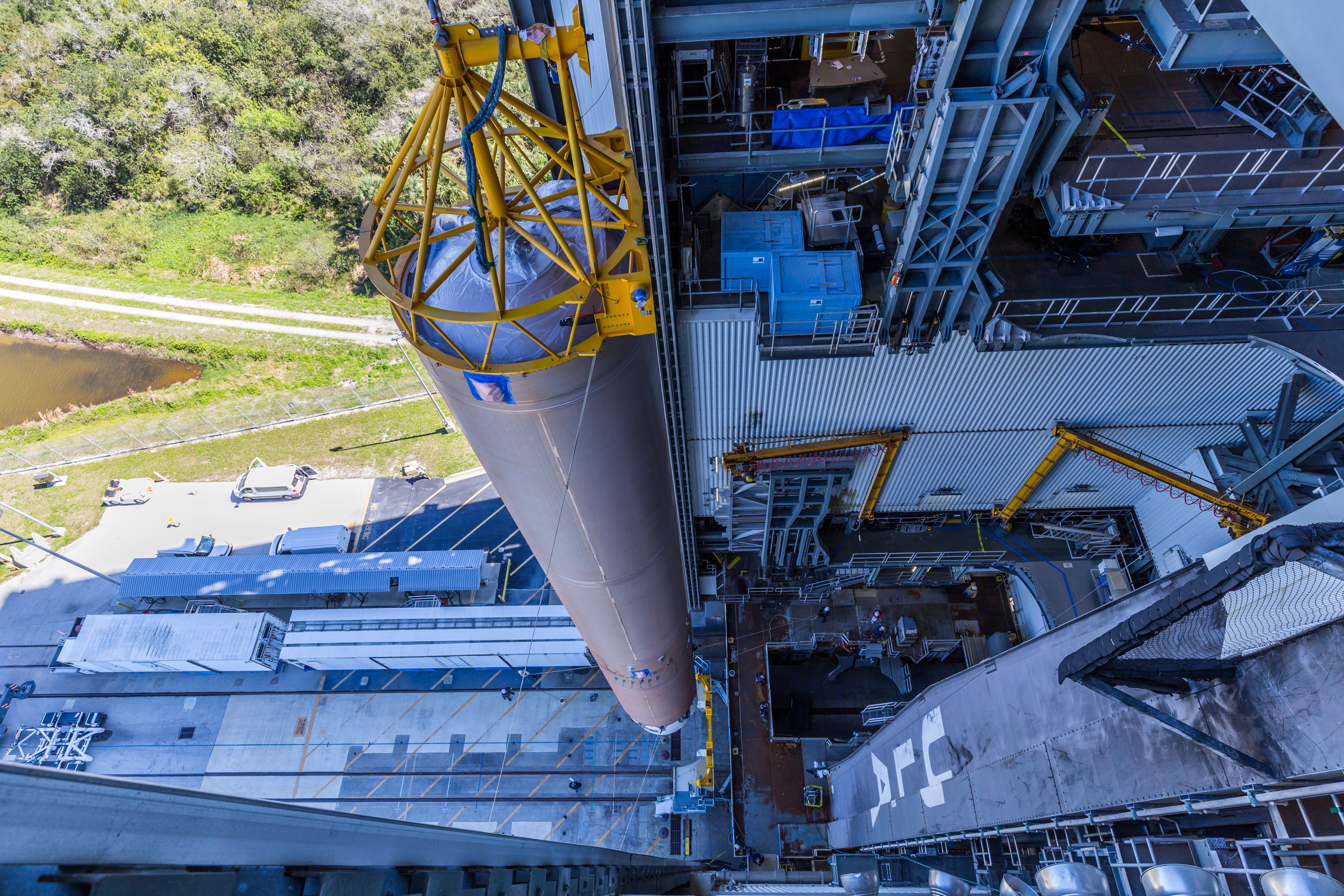 The Atlas V first stage to launch CFT is hoisted into the Vertical Integration Facility. Photo by United Launch Alliance