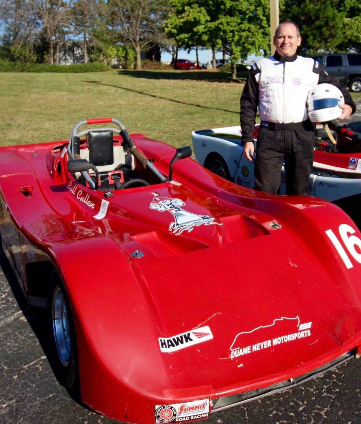 Cullen poses with his racecar.