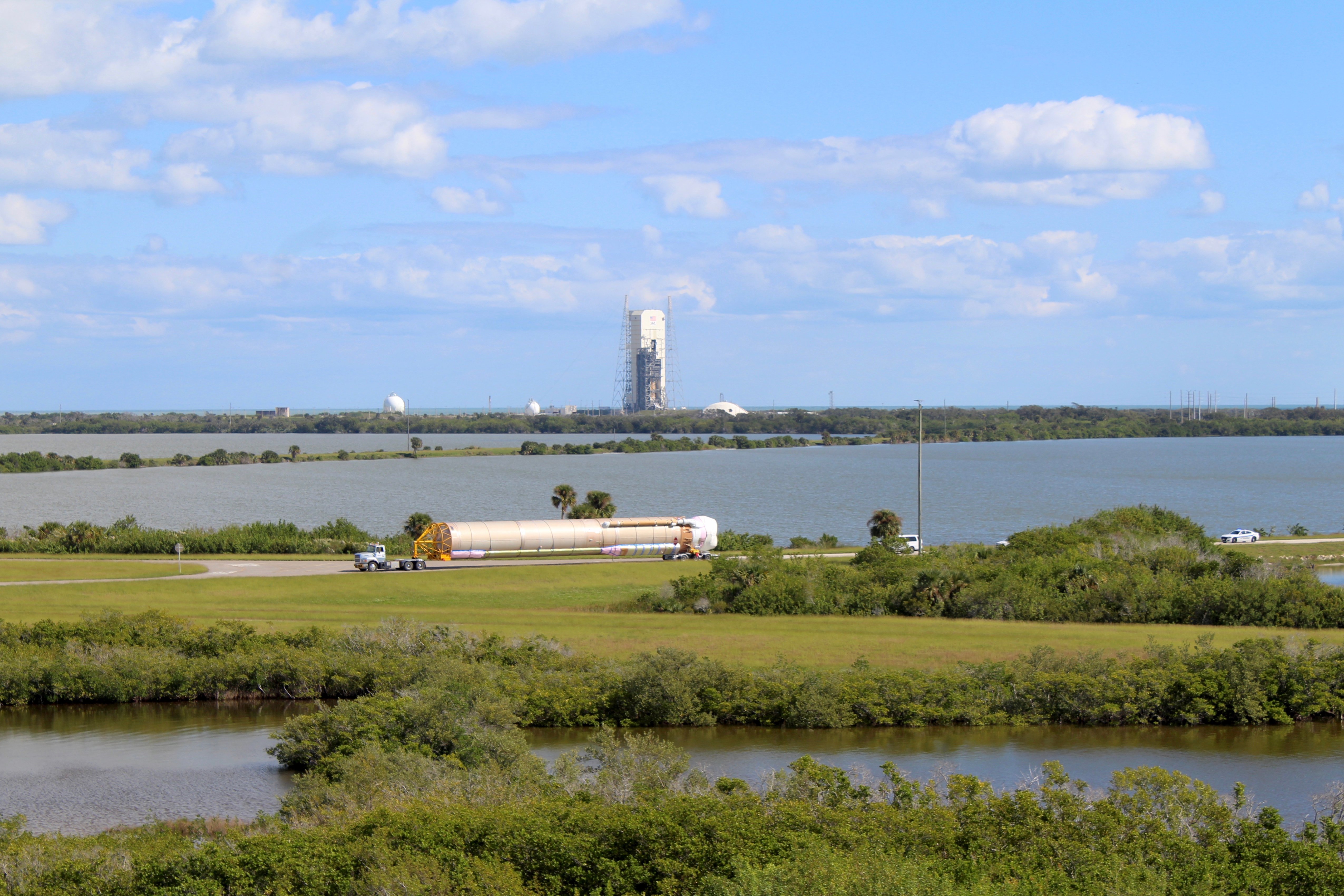 The Atlas V first stage is transported along the ITL Causeway. Photo by United Launch Alliance